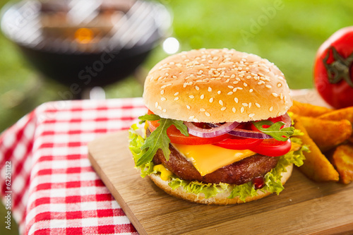 Photo: Tasty cheeseburger with melted cheddar Tasty cheeseburger with melted cheddar