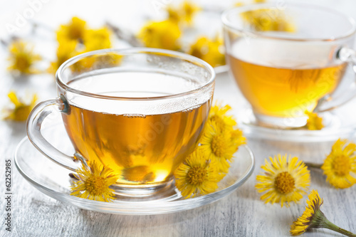 Photo: herbal tea with coltsfoot flowers herbal tea with coltsfoot flowers