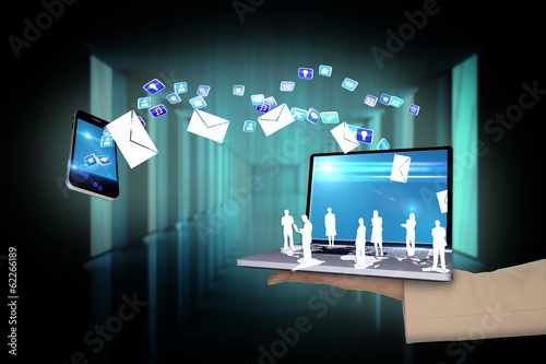 Photo: Hand presenting laptop connecting to phone Hand presenting laptop connecting to phone