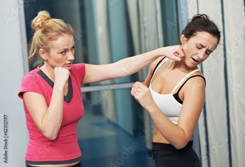 Photo: healthy woman at fitness fighting training healthy woman at fitness fighting training