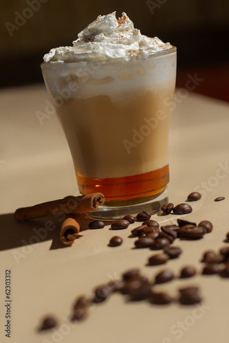 Photo: Image of tasty cup of coffe with cream Image of tasty cup of coffe with cream