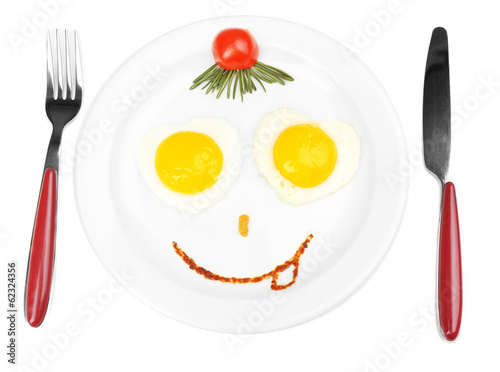 Photo: Scrambled eggs with bread on plate, on color napkin Scrambled eggs with bread on plate, on color napkin