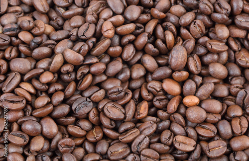 Photo: Agriculture, closeup of roasted coffee beans background Agriculture, closeup of roasted coffee beans background