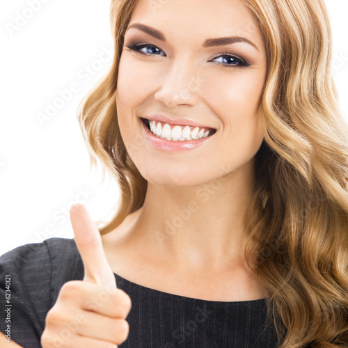 Photo: Woman with thumbs up gesture, over white Woman with thumbs up gesture, over white