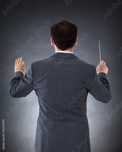 Photo: Orchestra Conductor With Baton Orchestra Conductor With Baton