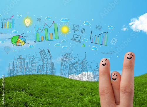 Photo: Happy smiley fingers looking at hand drawn urban city landscape Happy smiley fingers looking at hand drawn urban city landscape
