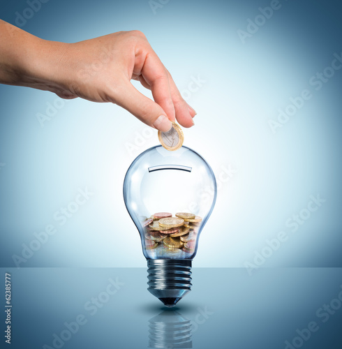 Photo: invest to energy concept - euro in bulb - piggybank invest to energy concept - euro in bulb - piggybank