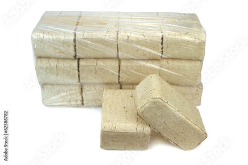 Photo: wood briquettes isolated on white background. wood briquettes isolated on white background.