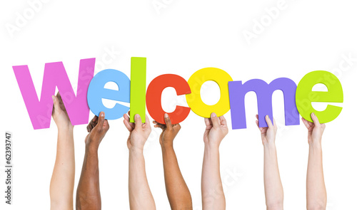 Photo: Multi-Ethnic Group Of People Holding The Word Welcome Multi-Ethnic Group Of People Holding The Word Welcome