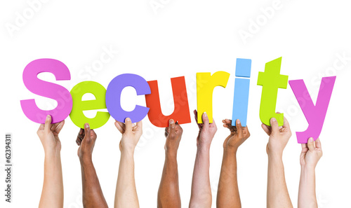 Photo: Multi-Ethnic Hands Holding The word Security Multi-Ethnic Hands Holding The word Security