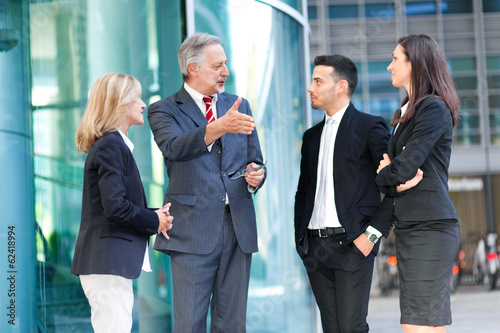 Photo: Businesspeople talking outdoor Businesspeople talking outdoor