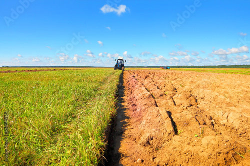 Photo: Tractor on a farmer field Tractor on a farmer field