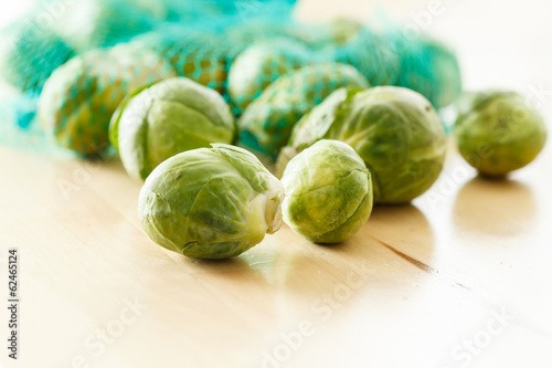 Photo: Brussels sprouts cabbage on old wooden table Brussels sprouts cabbage on old wooden table
