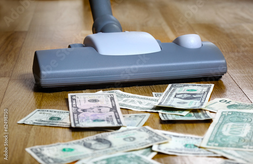 Photo: Vacuuming money polish money Vacuuming money polish money