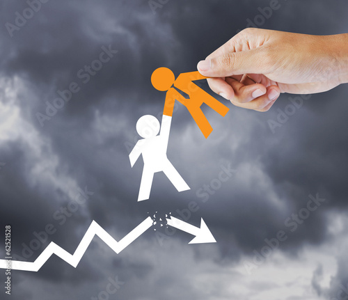Photo: Leader helping a businessman from crisis, leadership concept Leader helping a businessman from crisis, leadership concept