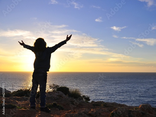 Photo: Boy hugging the sun Boy hugging the sun