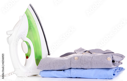 Photo: Iron with shirts isolated on white Iron with shirts isolated on white