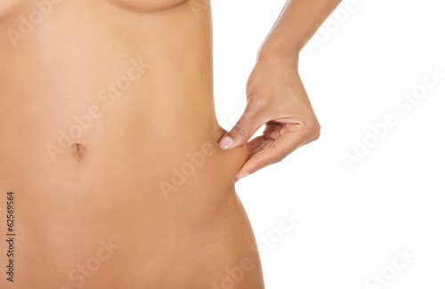 Photo: Naked woman holding fat. Naked woman holding fat.