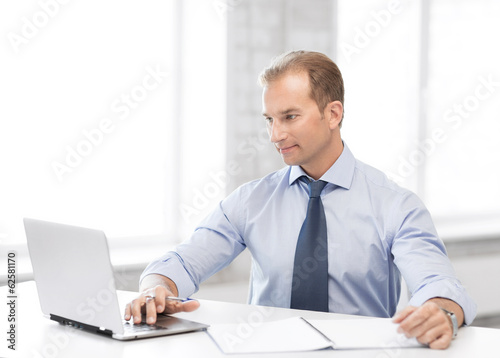 Photo: miling businessman working in office miling businessman working in office