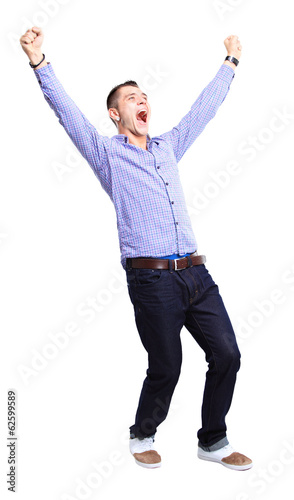 Photo: Excited handsome man with arms raised in success Excited handsome man with arms raised in success