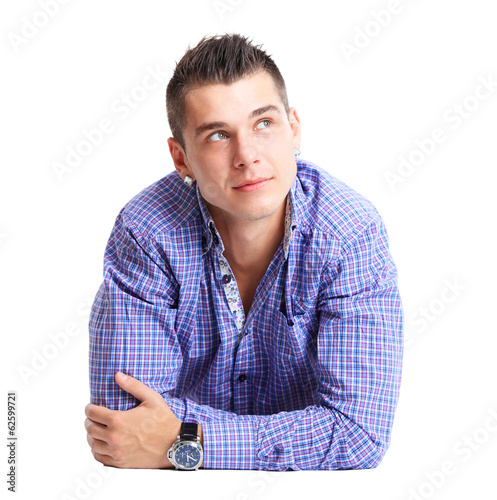 Photo: Man lying on floor with arms crossed Man lying on floor with arms crossed