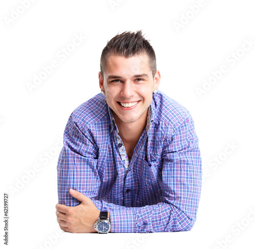 Photo: Man lying on floor with arms crossed Man lying on floor with arms crossed