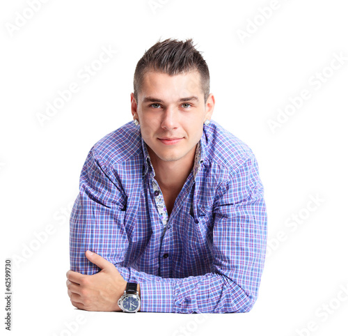 Photo: Man lying on floor with arms crossed Man lying on floor with arms crossed