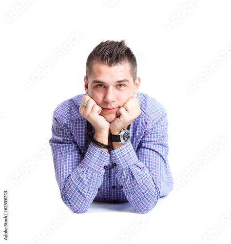 Photo: Man lying on floor with arms crossed Man lying on floor with arms crossed