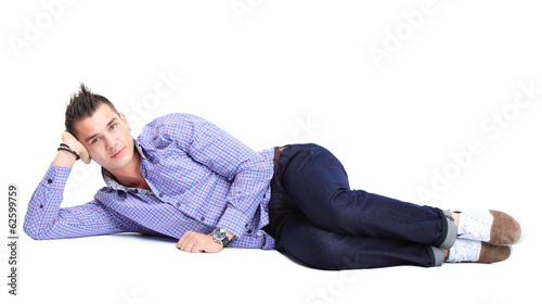 Photo: Flirtatious man sitting on the floor Flirtatious man sitting on the floor