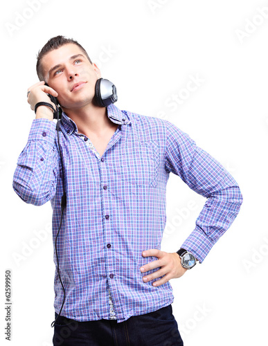 Photo: Attractive young man wearing headphones on white background Attractive young man wearing headphones on white background