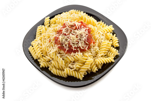 Photo: pasta fusilli in plate on white pasta fusilli in plate on white