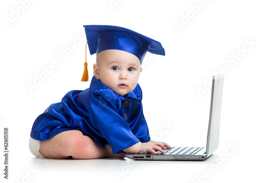 Photo: funny kid in academician clothes using laptop funny kid in academician clothes using laptop