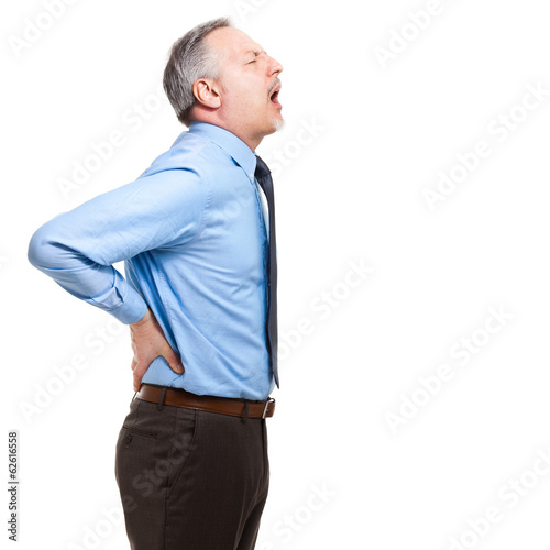 Photo: Man struggles with intense back pain on white background Man struggles with intense back pain on white background