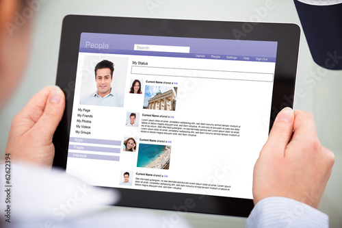 Photo: Businessperson Using Digital Tablet Businessperson Using Digital Tablet