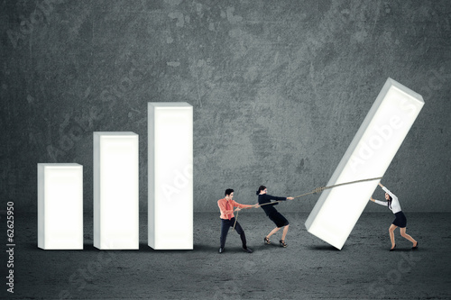 Photo: Business people are building business chart Business people are building business chart