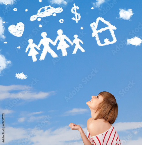 Photo: Young girl daydreaming with family and household clouds Young girl daydreaming with family and household clouds