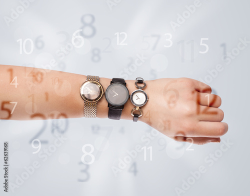Photo: Hand with watch and numbers on the side comming out Hand with watch and numbers on the side comming out