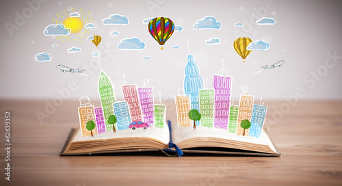 Photo: cityscape drawing on open book cityscape drawing on open book