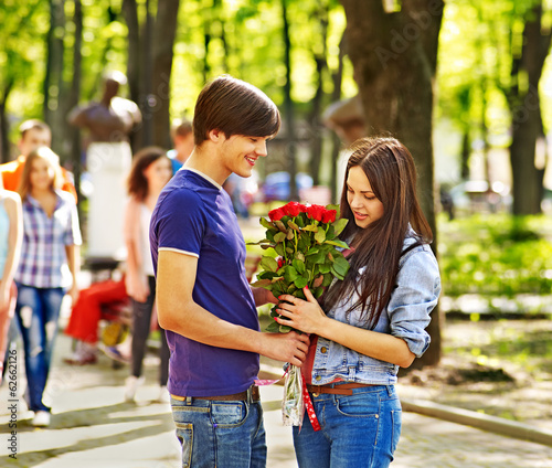 Photo: Couple of people on date outdoor. Couple of people on date outdoor.