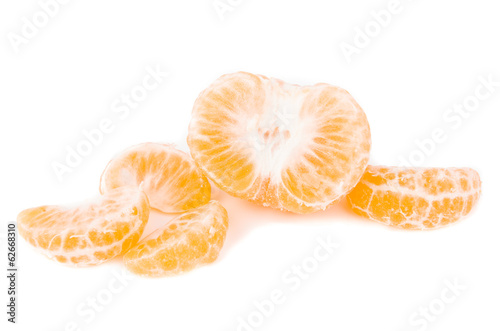 Photo: tangerine slice on a white background tangerine slice on a white background