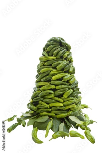 Photo: Vegetable green pepper pyramid isolated on white Vegetable green pepper pyramid isolated on white