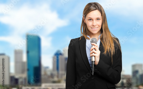 Photo: Woman talking on the microphone Woman talking on the microphone