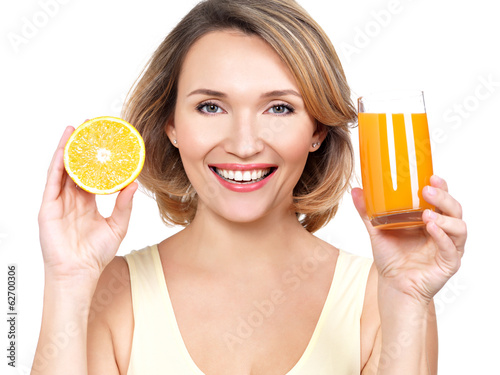Photo: Portrait of a beautiful young woman with a glass of juice. Portrait of a beautiful young woman with a glass of juice.
