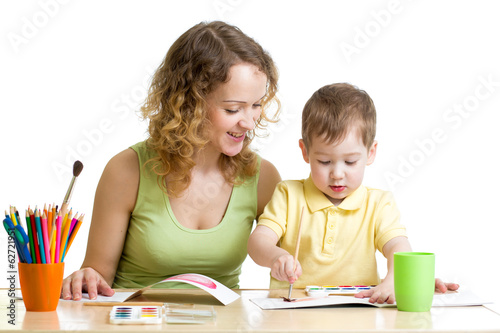 Photo: mother and kid boy paint together mother and kid boy paint together