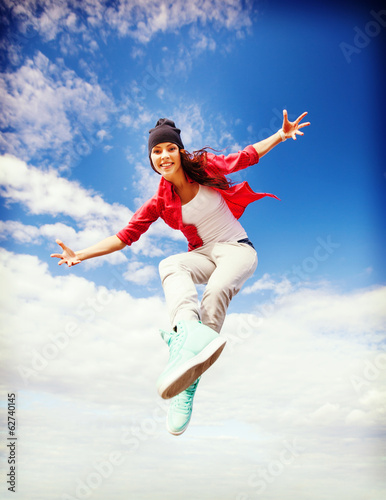 Photo: beautiful dancing girl jumping beautiful dancing girl jumping