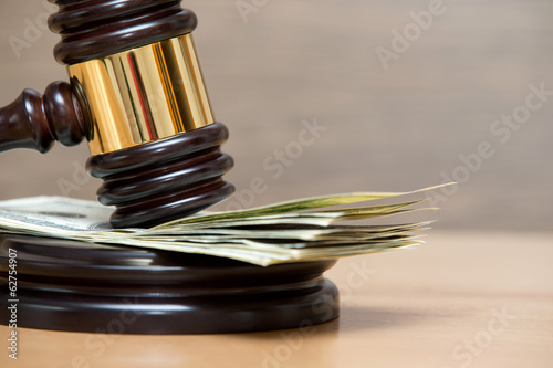 Photo: gavel on a money gavel on a money