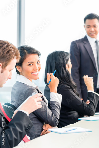 Photo: Asian Businesspeople in office team meeting Asian Businesspeople in office team meeting