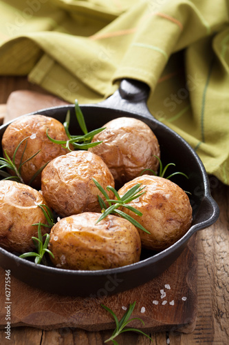 Photo: baked potatoes in black pan baked potatoes in black pan