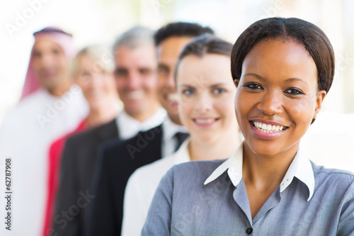 Photo: group of business team standing in a row group of business team standing in a row