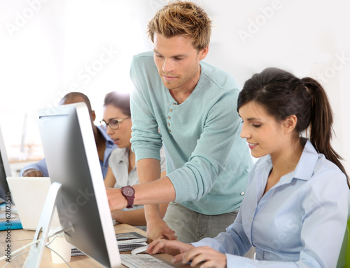 Photo: Group of young adults in business training Group of young adults in business training